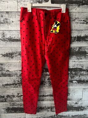 Women’s NWT Disney x Forever 21 collab red pants with black Mickey pattern.